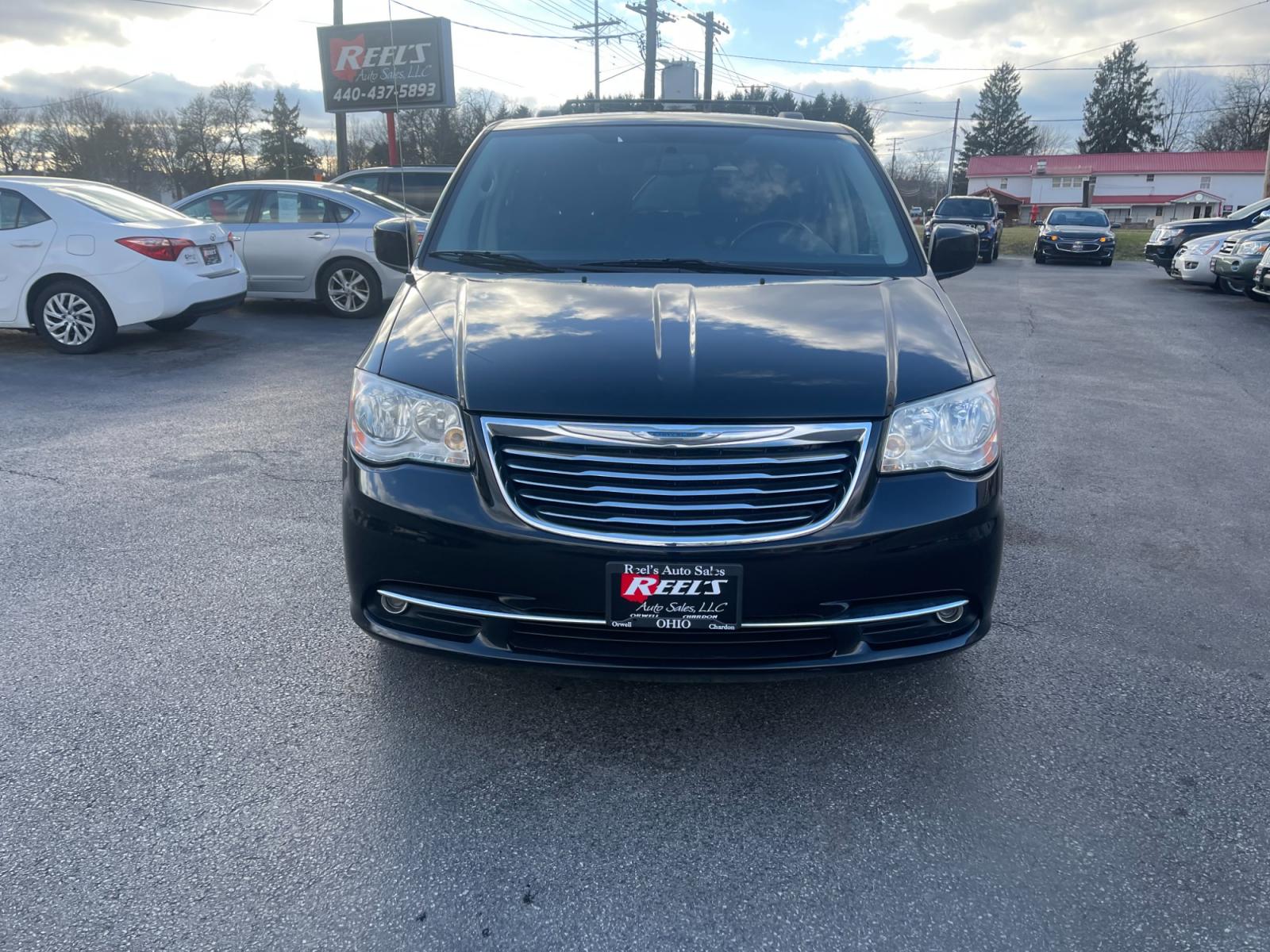 2012 Black /Black Chrysler Town & Country (2C4RC1BG0CR) with an 3.6L V6 DOHC 24V FFV engine, 6-Speed Automatic transmission, located at 11115 Chardon Rd. , Chardon, OH, 44024, (440) 214-9705, 41.580246, -81.241943 - This 2012 Chrysler Town & Country Touring - L model features a luxurious interior with cloth seats that are heated for comfort, complemented by a heated steering wheel for added warmth in cooler weather. It comes equipped with a convenient tow package, enhancing its utility for pulling trailers or b - Photo #1